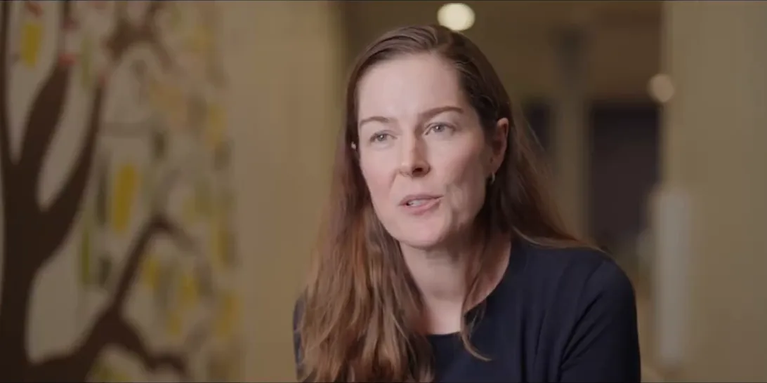 Woman speaking during a seated interview for a corporate video