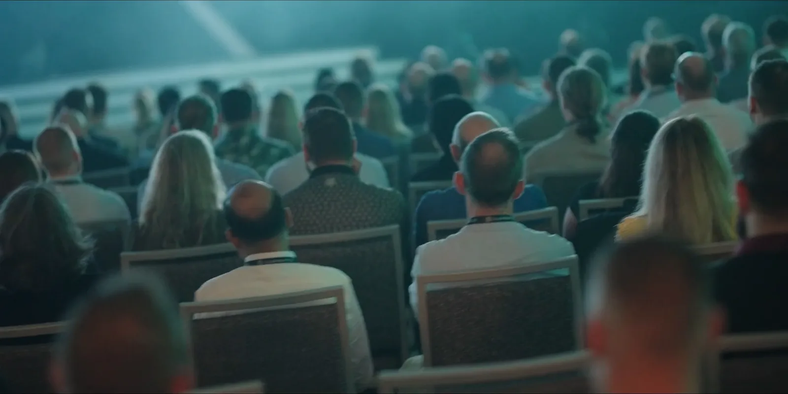 Seated audience at Lumine Group's Illuminate leadership event